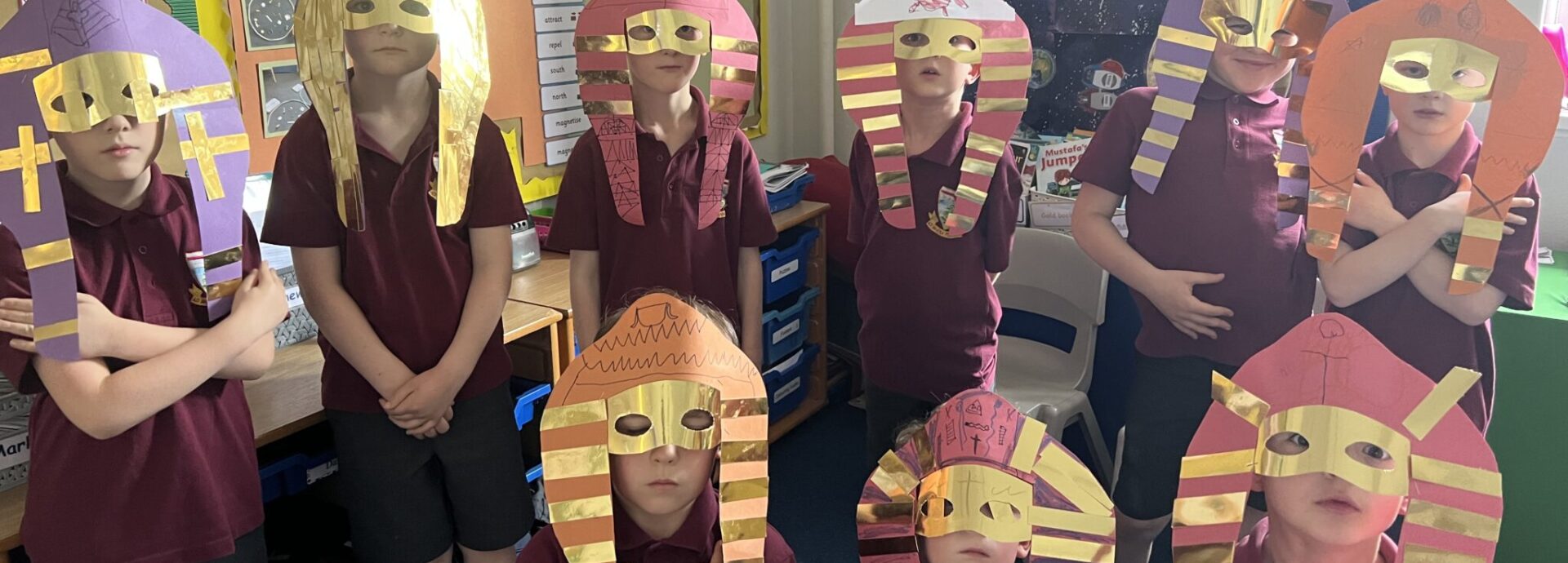 students wearing Egyptian masks