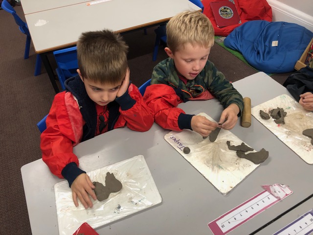 students working with clay