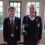 students holding a trophy