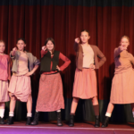 students practicing dance moves