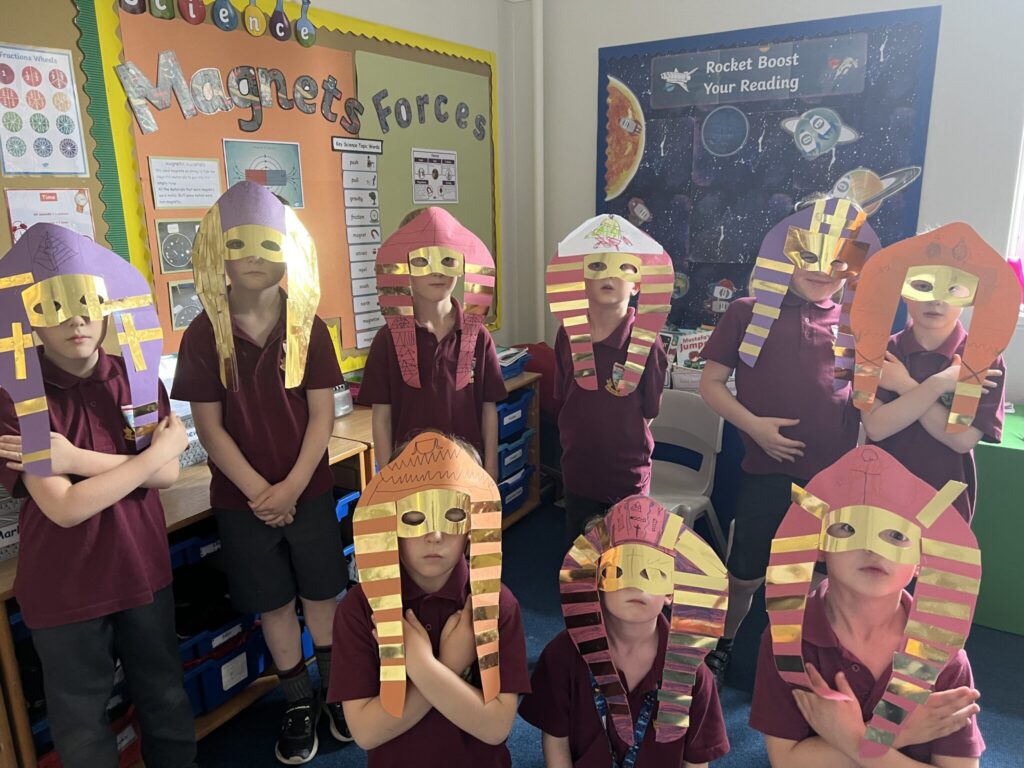 students wearing Egyptian masks
